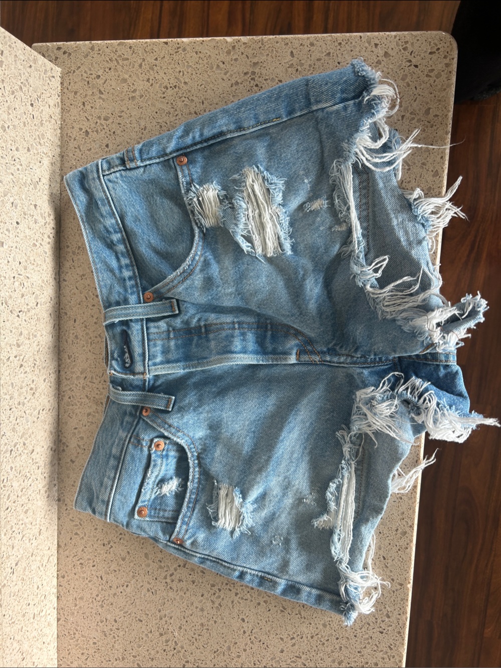 High-Rise Light Blue Distressed Denim Shorts